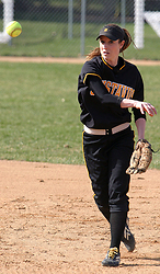 Julie Mahre throws to first base.