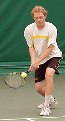 Mike Burdakin sets to hit a backhand return.