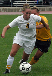 Callie Christensen fights to get past a Cobber defender.