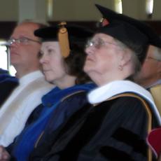 Sponberg (right) listens to MAYDAY! keynote speaker Dawn Calabia with Deborah Downs-Miers (English) and Chaplain Brian Johnson.