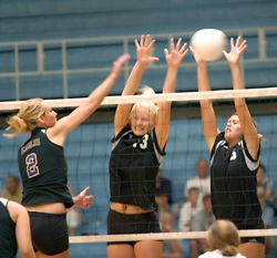Jenni Thelemann and Becca Thompson go up for the block in the Gusties win over Northwestern