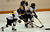 Christine Wicker and Jessica Doig battle for positioning to get to the puck.