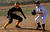 Gustavus runner leads off third base.
