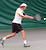 Nick Hansen rips a backhand in his doubles match.
