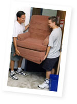 Father and son moving a chair