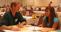 Professor Jon Grinnell helps a student select classes.