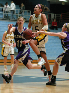 Bri Radtke grimaces as she charges to the hoop for two.