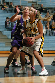Emily Nelson looks to shoot after a rebound,.