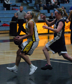 Emily Nelson scores on a breakaway layup.