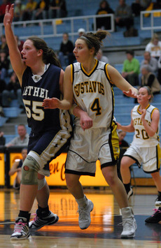 Julia Schultz of Gustavus battles Annagret Nautsch of Bethel for position on the block.