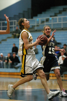 Molly Mathiowetz splits the Bethel defense and drives in for a layup.
