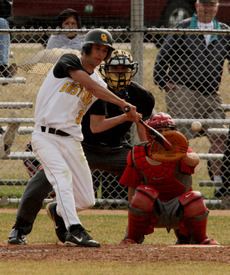 Junior Andrew Woitas fights off the outside pitch. (Photo Courtesy: Brian Fowler, SportPix)