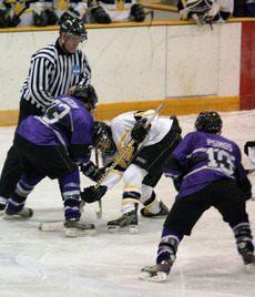 Melissa Mackley battles to win a face-off for the Gusties.