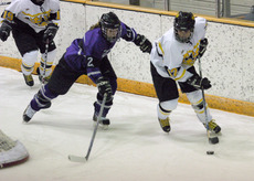 Jessie Doig handles the puck behind the St. Thomas net.
