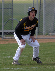 Spencer Campion takes his lead after hitting a triple.