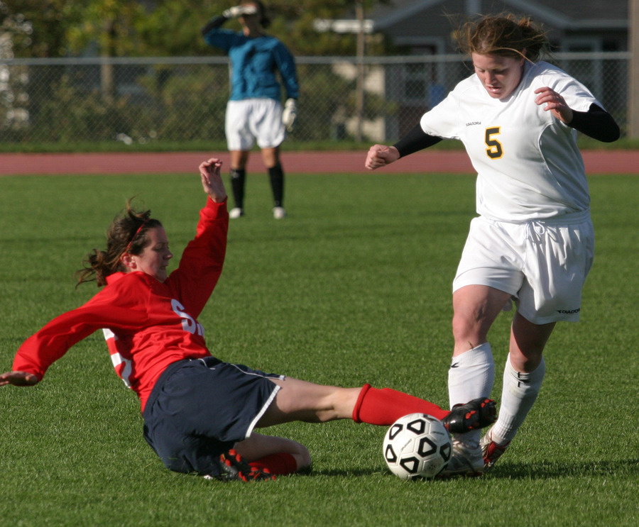 Junior defender Shannon Quealy takes the ball away from a Cardinal attacker.