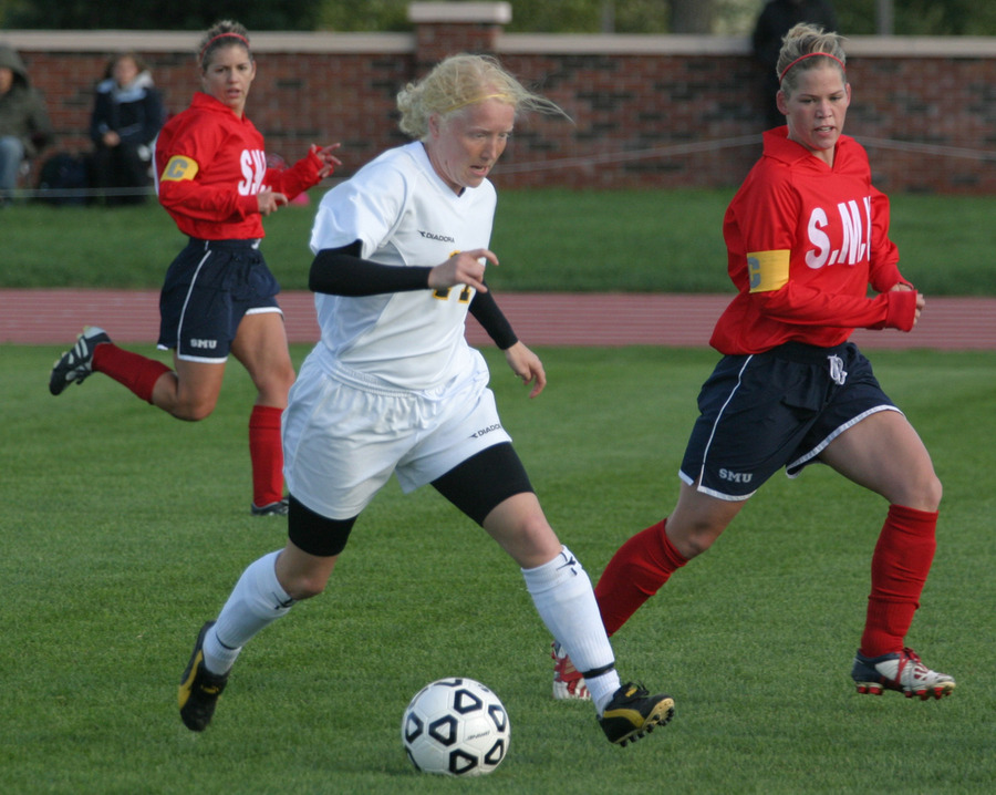 Senior forward Samantha Engh dribbles up the center of the field.