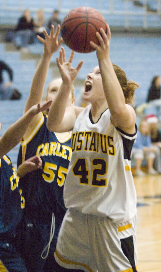 Vicky Peterson gets fouled as she goes up to score.