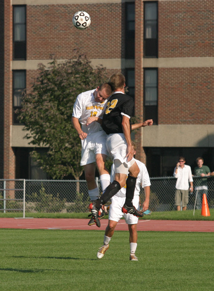 Kroog elevates for the ball against St. Olaf.