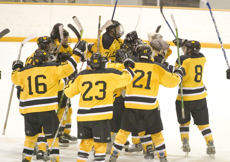 The Gusties celebrate their overtime victory against St. Olaf.
