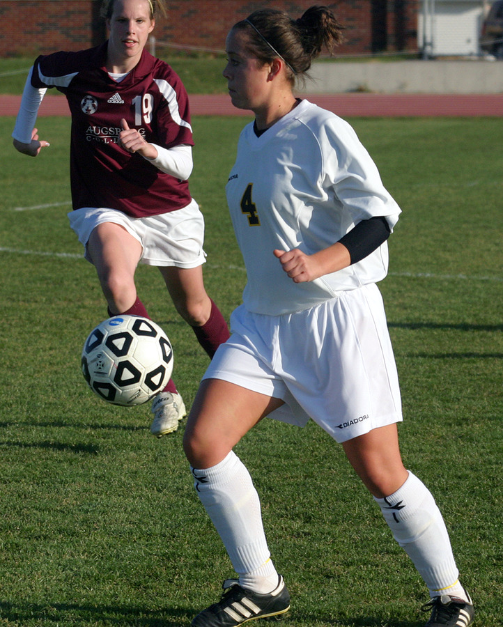 Megan Tepper looks up field with control of the ball.