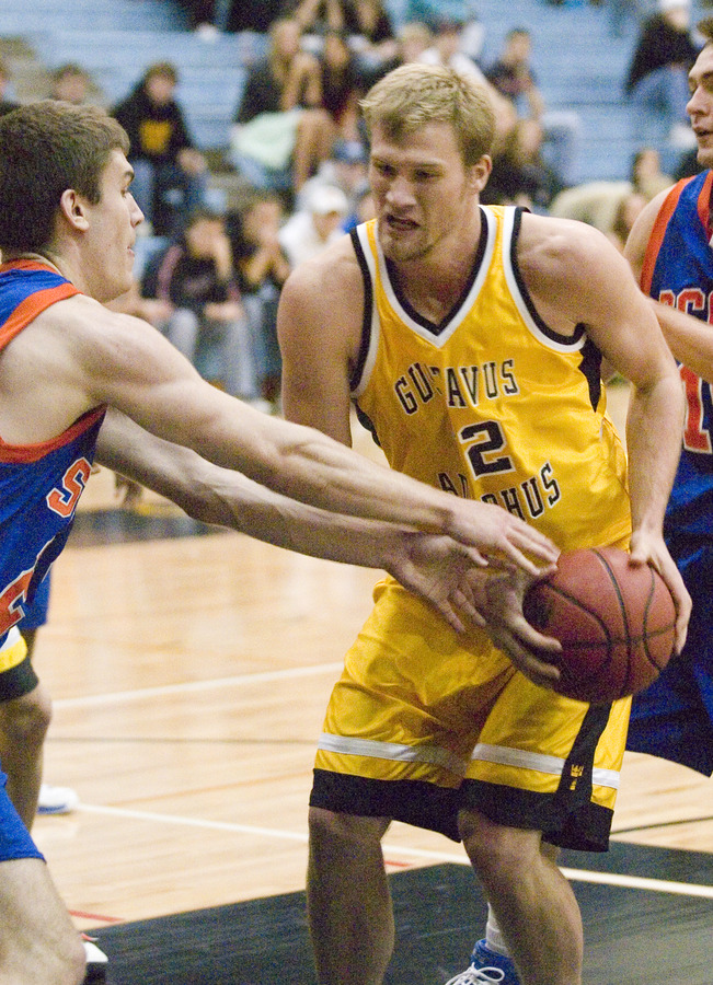 Jay Stien protects the ball from a Scot.