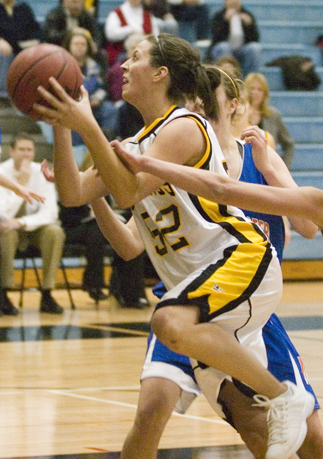 Bri Monahan goes strong to the hoop.