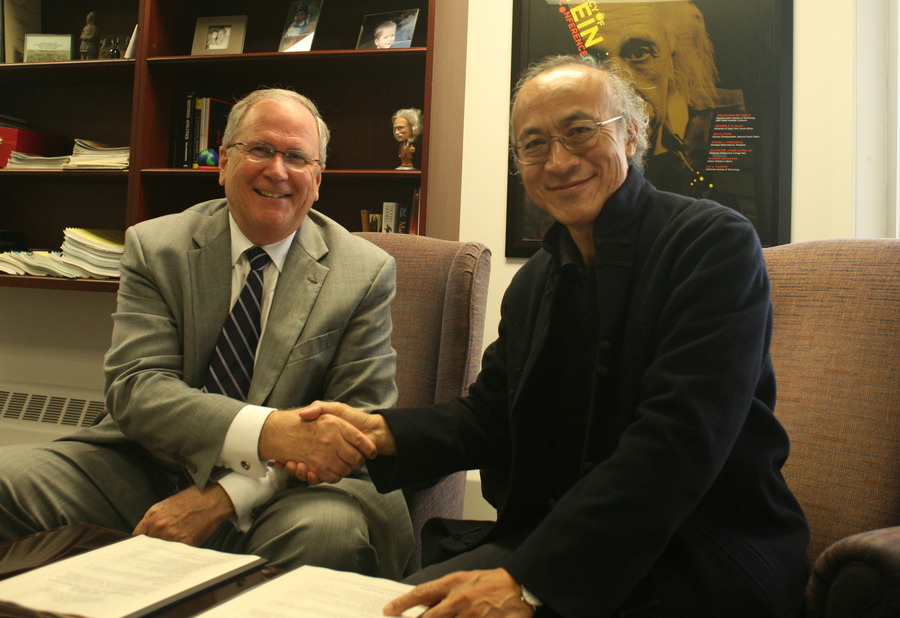 President Jim Peterson and Edmond Kwok signed a reciprocal student exchange agreement on Oct. 2.