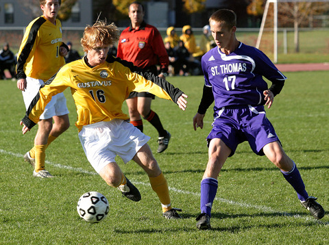 Jack Underwood dribbles the ball at midfield.