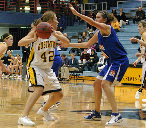 Captain Vicky Peterson squares up to the basket against a Macalester defender.