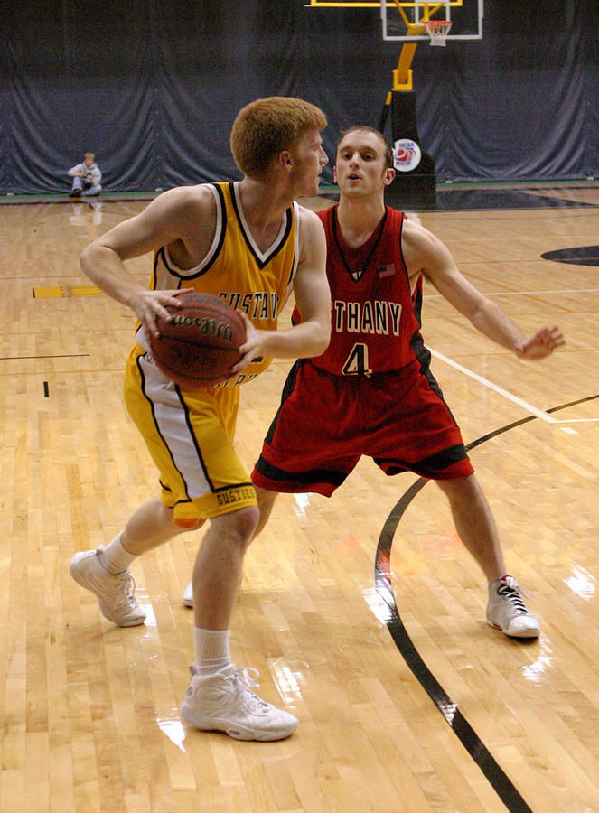 Mike DesLauriers, who scored a season high 14 points, is closely guarded in the corner by Tommy Saffert.