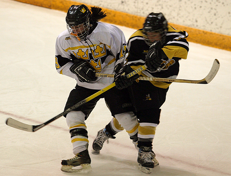Lisa Sablak fights for positioning with a UW-Superior player.
