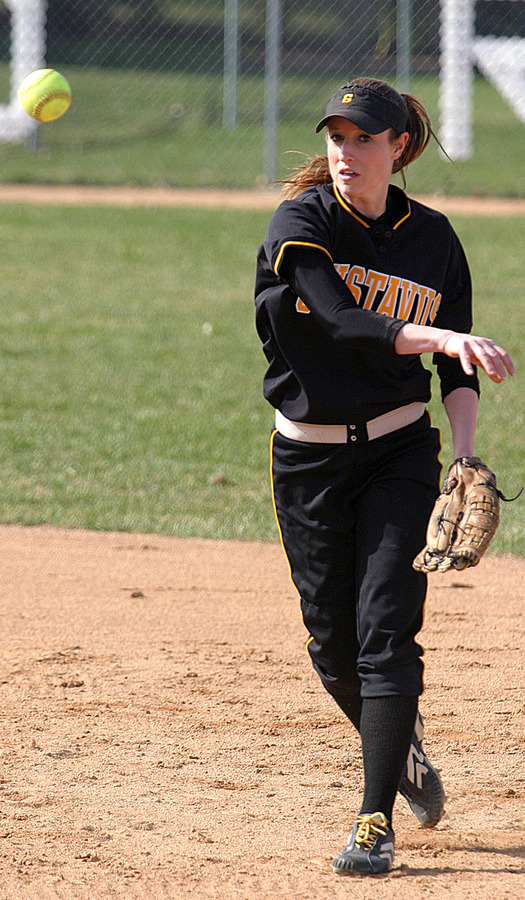 Julie Mahre throws to first base.