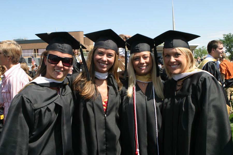 A group of 2007 graduates gather for a photo after last year’s commencement ceremony.