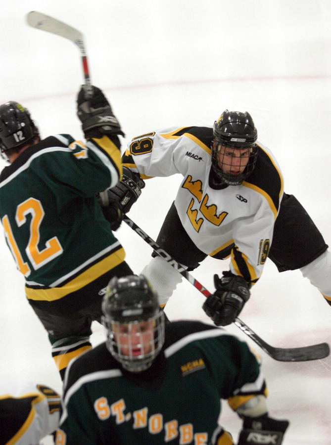 Brad Wieck looks for the puck in front of the net.