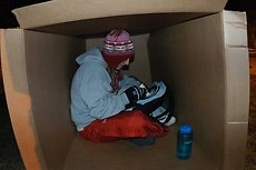 A Gustavus student studies during a past Hunger and Homelessness Week sleep out.