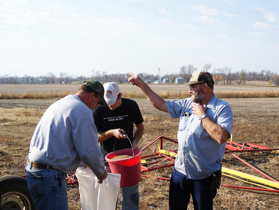 Representatives from Feder’s Prairie Seed Co. prepare to seed the Coneflower Prairie.