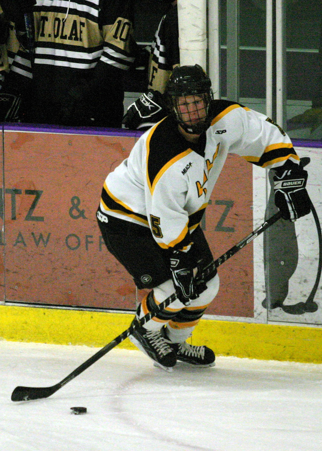 Spencer Campion looks up ice for an open skater.