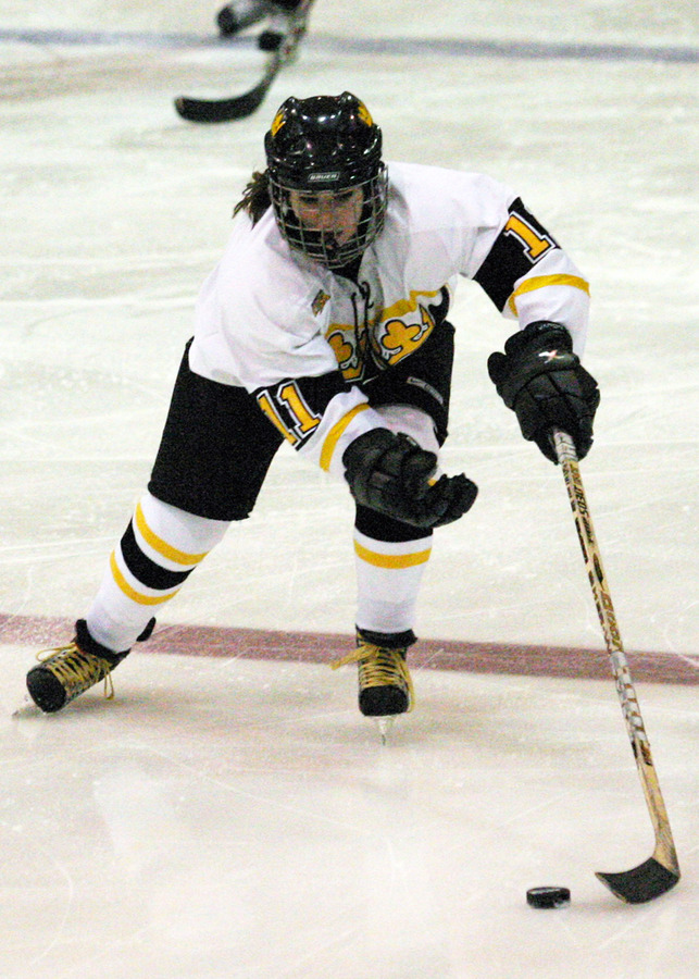 Lynn Hillen chases down the puck at neutral ice.
