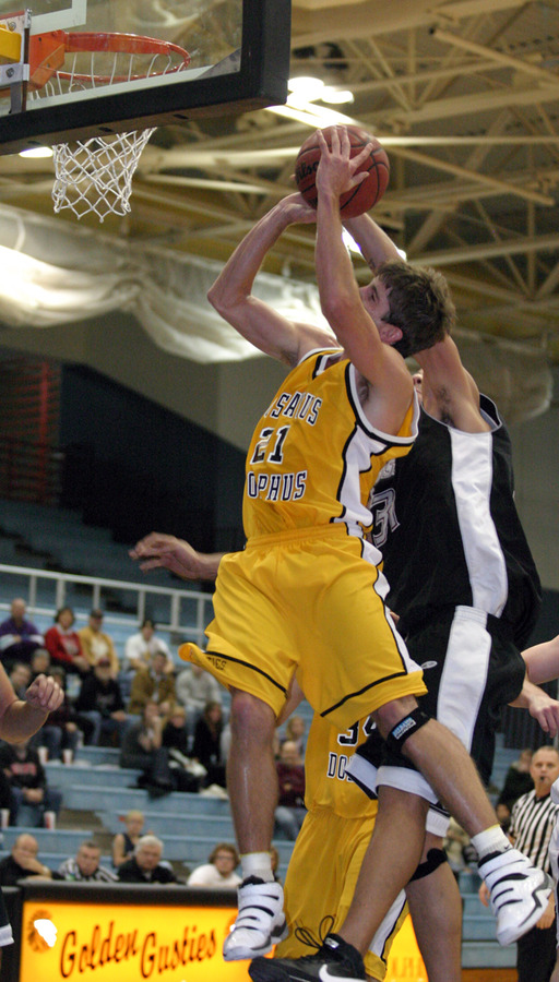 Jesse Van Sickle is fouled as he goes up for the layup.