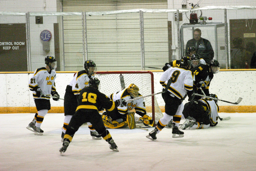 Matt Lopes makes a save during a scramble in front of the net.