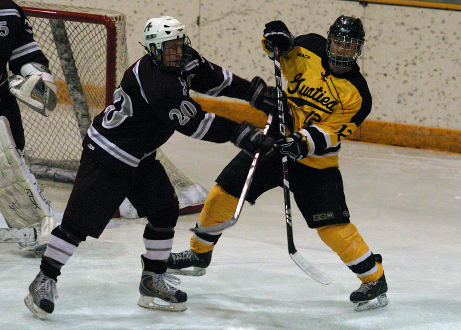 Mike Carr battles for position in front of the Augsburg net.