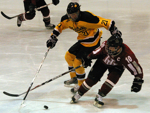 Joe Welch fights to get to the puck.