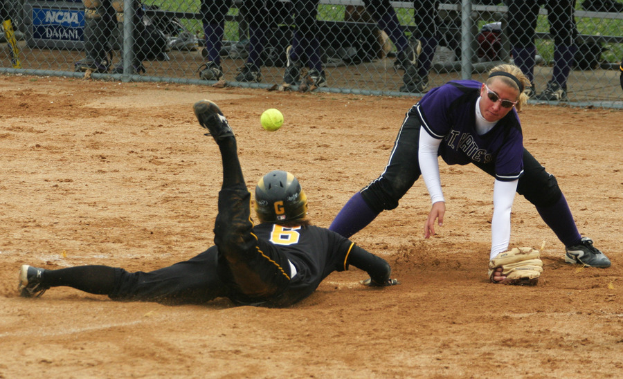 Emily Klein slides safely in to home.