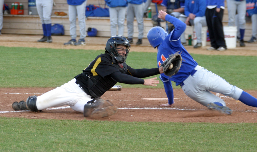 Matt Morgan tries to apply the tag on the runner at home.