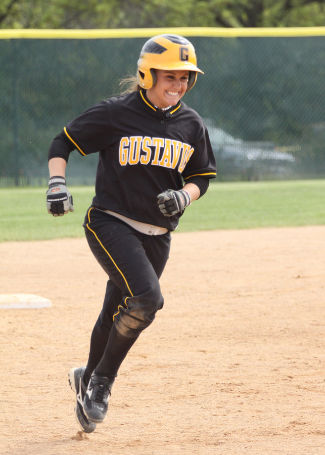 Lisa Klass smiles as she heads for third base after hitting a two-run home run in the fifth inning.