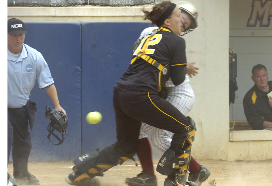 Catcher Dani Cattrysse tries unsuccessfully to tag a Coe player out at the plate in the first inning.
