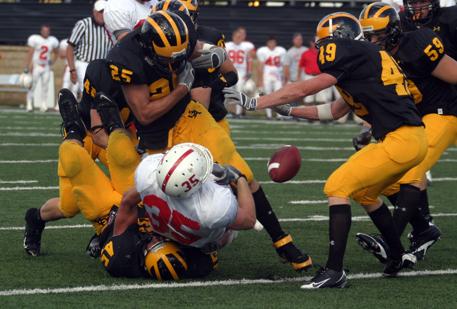 Dustin Kammerer’s big hit forces a Johnnie fumble.