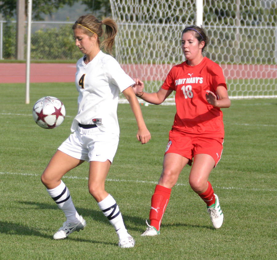 Becca Hagen traps the ball in front of a Cardinal defender.
