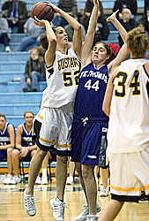 Bri Monahan shoots over a Tommie defender